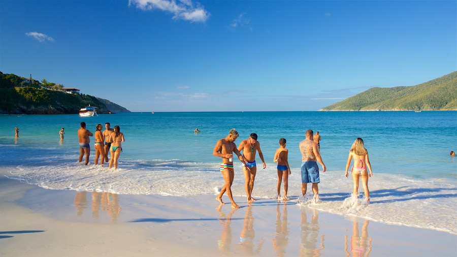 Pontal do Atalaia Beach showing general coastal views, swimming and a beach