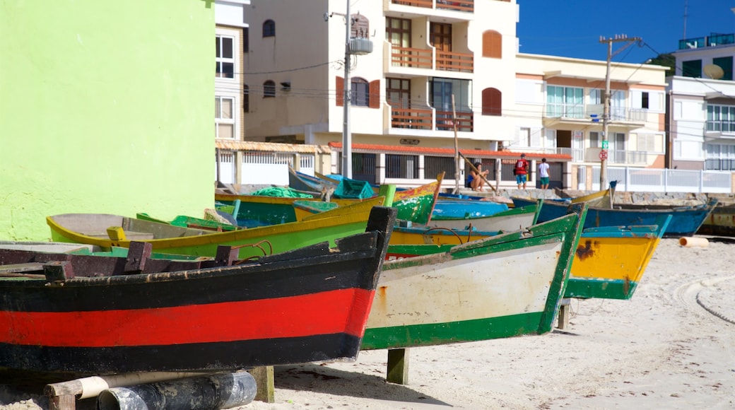 Prainha Beach which includes a sandy beach and a coastal town