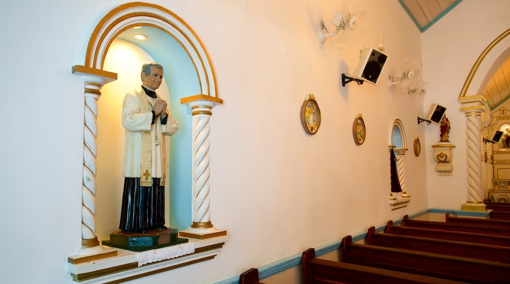 Our Lady of Remedies Church which includes a church or cathedral, interior views and religious elements