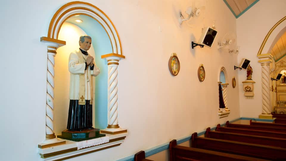 Our Lady of Remedies Church which includes a church or cathedral, religious aspects and interior views