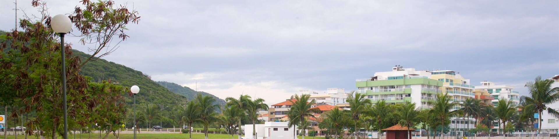 Hermes Barcellos Public Park which includes a lake or waterhole and a coastal town