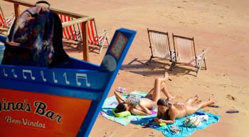 Joao Fernandes Beach which includes general coastal views and a sandy beach as well as a couple