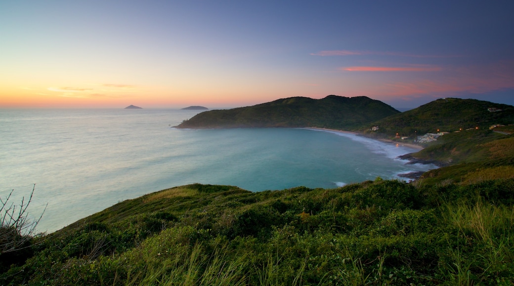 Mirador Joao Fernandes que incluye vista panorámica, vista general a la costa y un atardecer