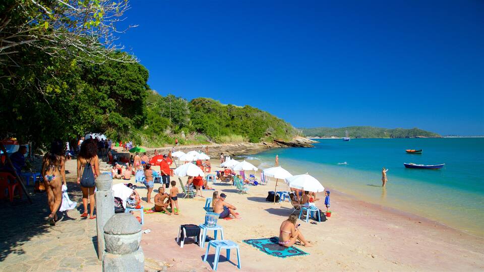 Azeda Beach featuring a sandy beach and general coastal views as well as a small group of people