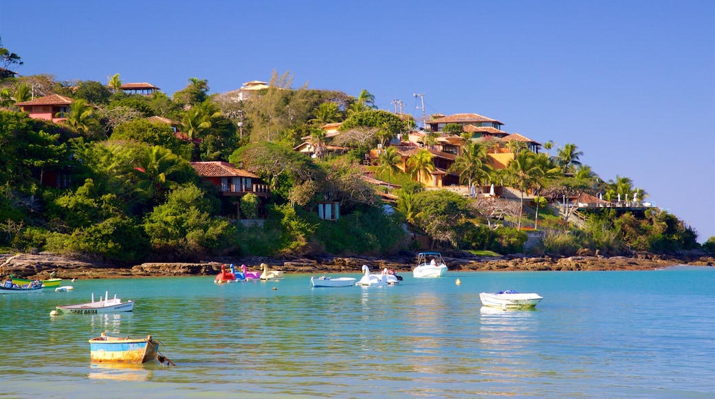 Ferradura Beach showing a coastal town and general coastal views