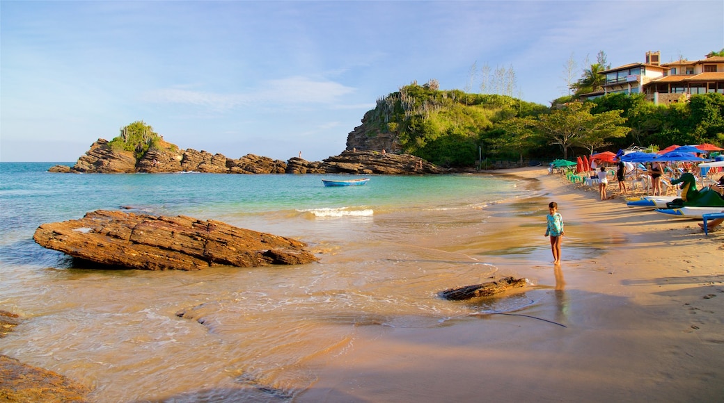 Ferradurinha Beach which includes a sandy beach, general coastal views and rocky coastline