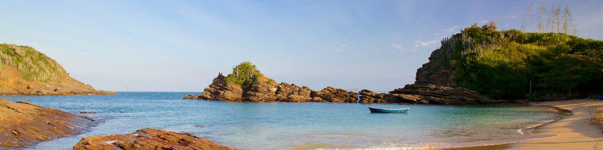 Ferradurinha Beach which includes rugged coastline, a sandy beach and a sunset