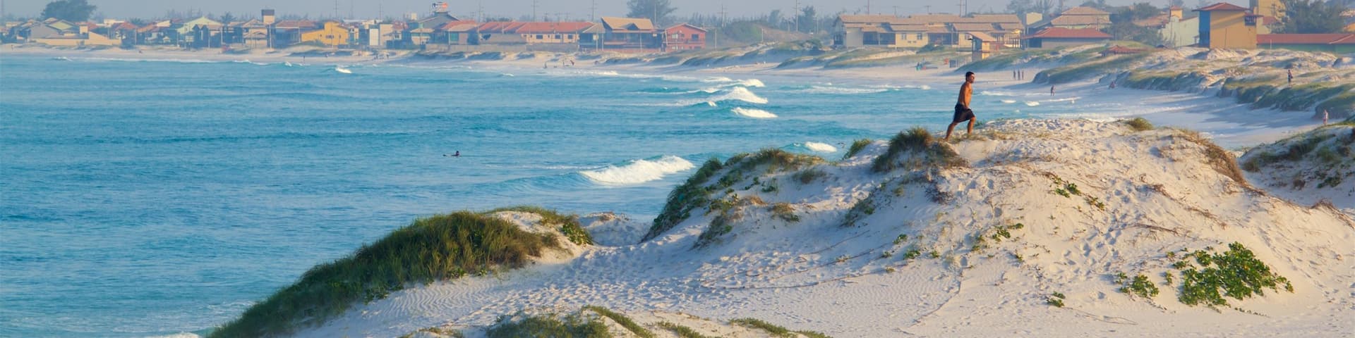 Dunas Beach showing a coastal town, general coastal views and a sandy beach