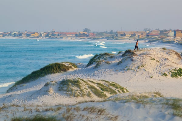 Strand von Dunas welches beinhaltet Strand, allgemeine Küstenansicht und Küstenort
