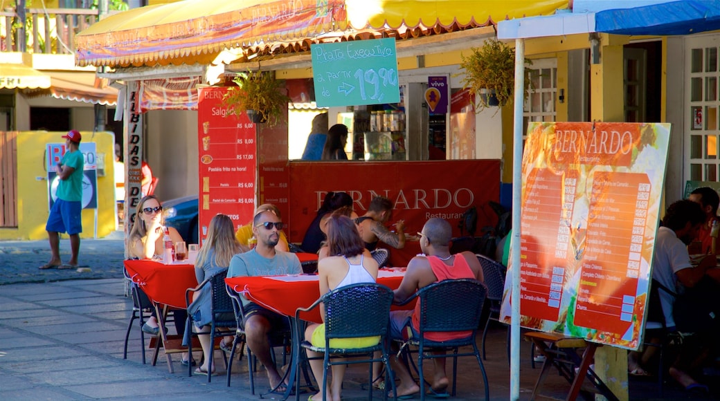 Santos Dumont Square featuring outdoor eating as well as a small group of people