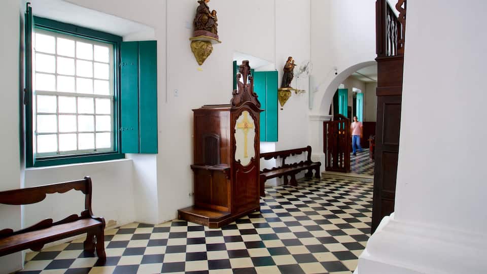 Parish Our Lady of the Assumption of Cabo Frio featuring interior views and religious elements