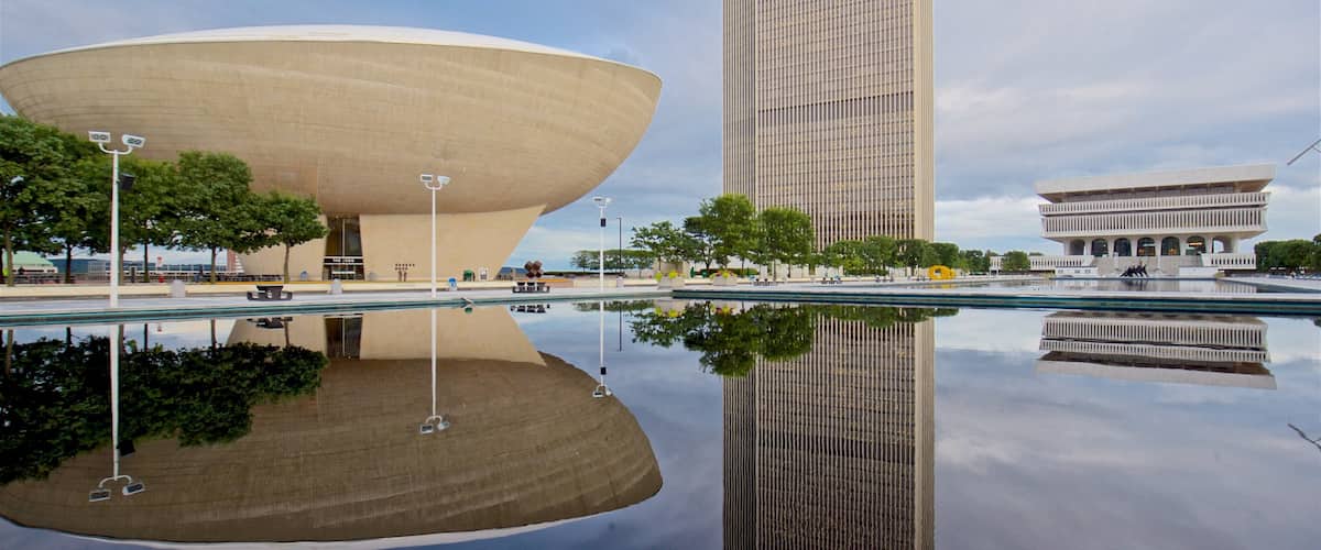 Governor Nelson A. Rockefeller Empire State Plaza featuring modern architecture, a pond and a high rise building