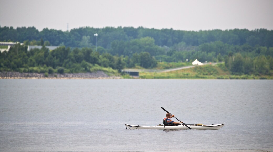 Onondaga Lake Park showing kayaking or canoeing and a lake or waterhole as well as an individual male