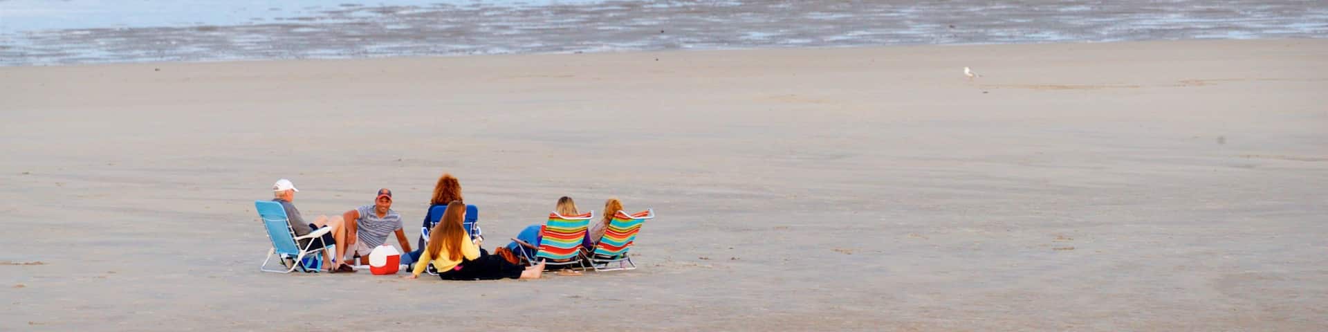 Ogunquit Beach showing a sandy beach and general coastal views as well as a small group of people