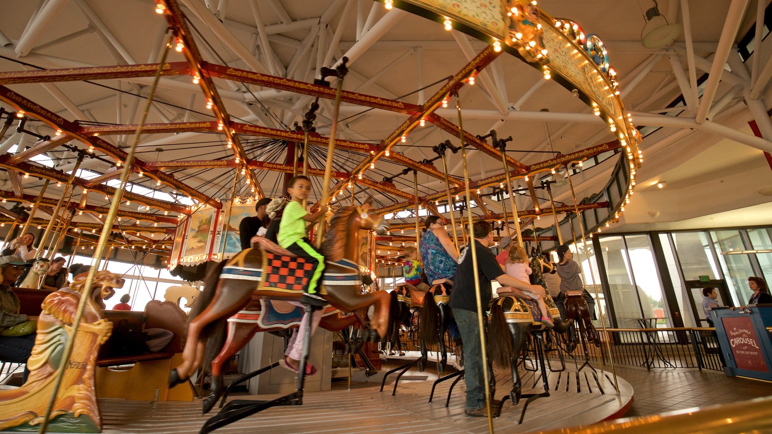 New York State Museum showing rides as well as children