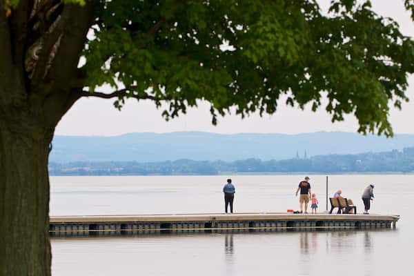 Onondaga Lake Park which includes a lake or waterhole as well as a small group of people