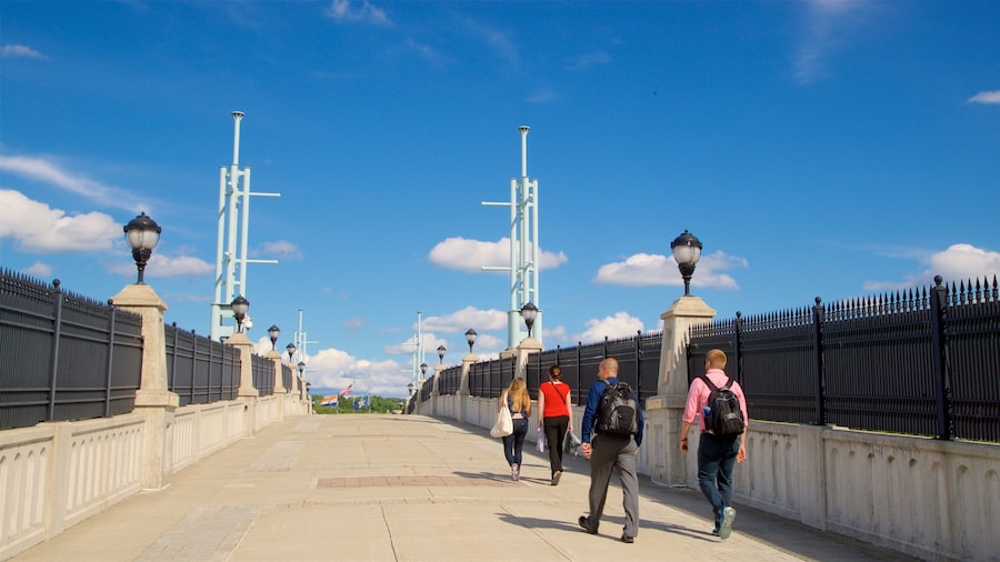 Hudson River Way showing a bridge as well as a small group of people