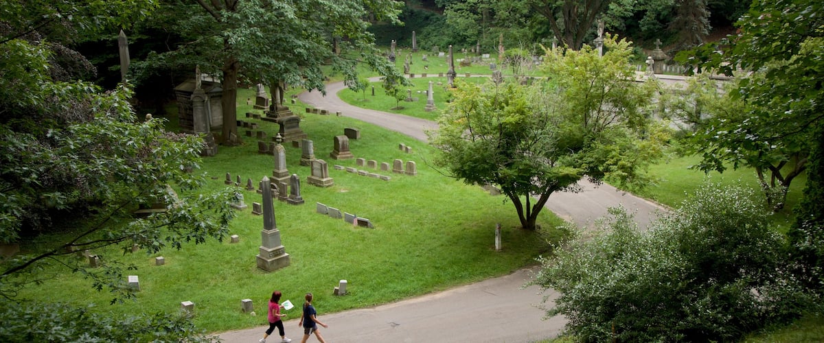 Mount Hope Cemetery which includes hiking or walking and a cemetery as well as a couple