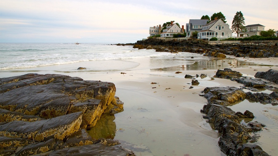 Mother\'s Beach which includes a sandy beach, rugged coastline and a house