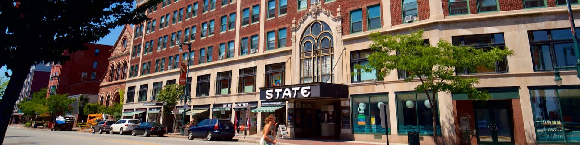 State Theatre showing street scenes as well as an individual femail