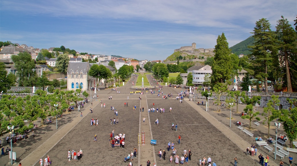 Lourdes - Tarbes featuring a city and landscape views as well as a large group of people
