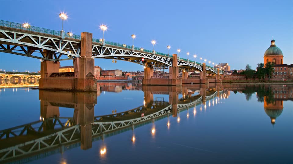Garonne which includes heritage architecture, a river or creek and night scenes