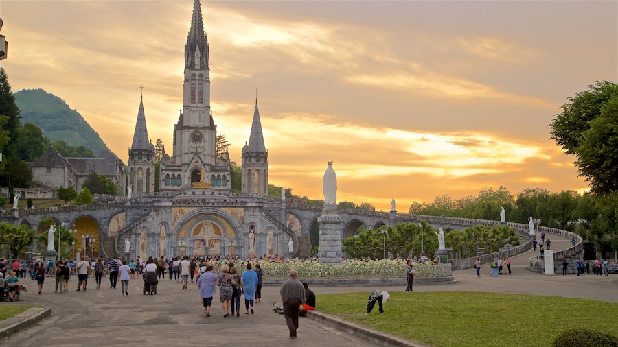 Lourdes - Tarbes showing a sunset, heritage architecture and a church or cathedral