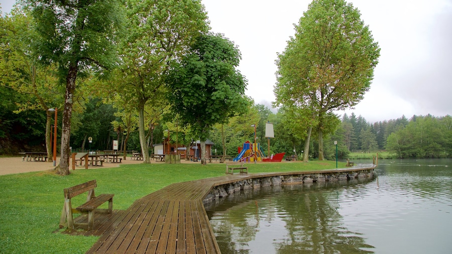 Lac de Lourdes featuring a lake or waterhole and a garden