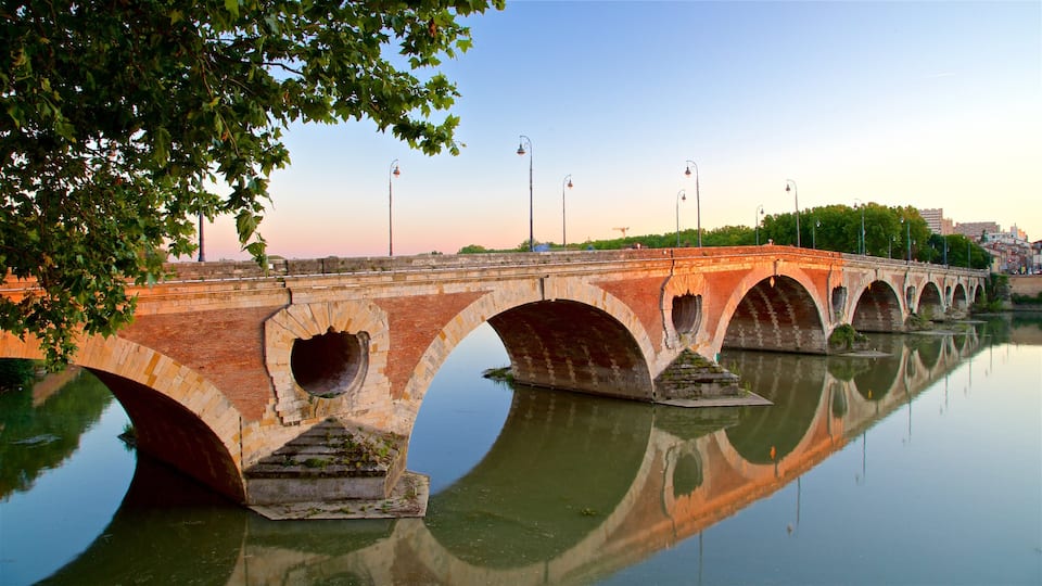 Pont Neuf showing a sunset, a bridge and a river or creek