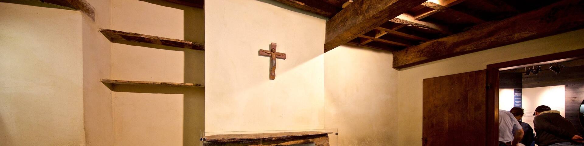 Le Cachot which includes religious aspects and interior views as well as a small group of people
