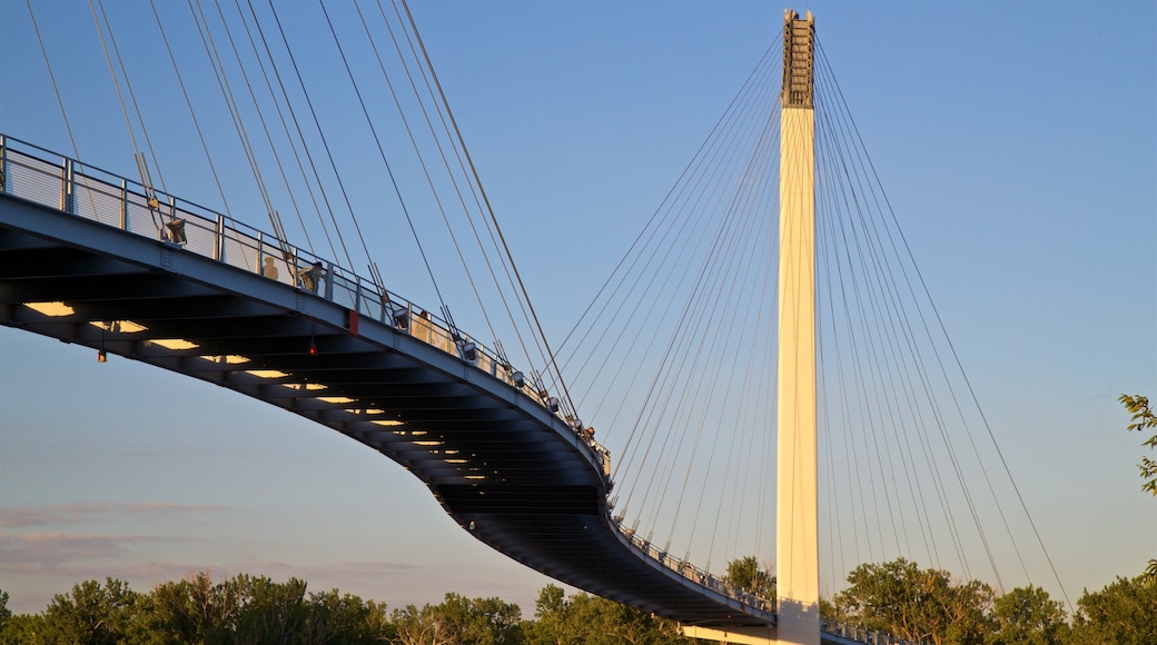 Bob Kerrey Pedestrian Bridge featuring a sunset and a bridge