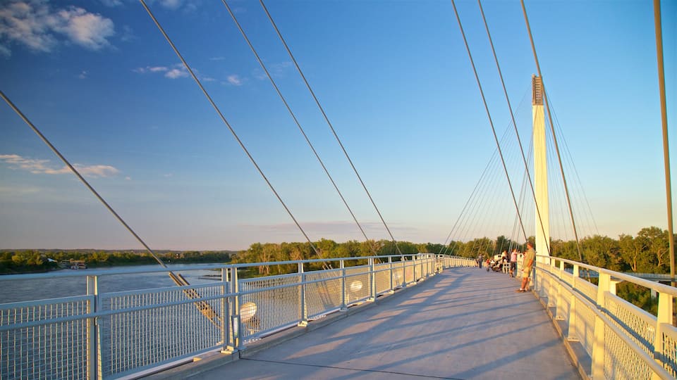 Bob Kerrey Pedestrian Bridge showing a sunset and a bridge