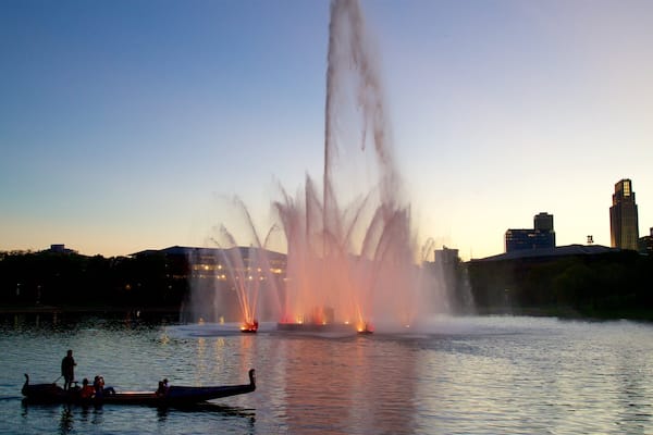 Heartland of America Park featuring kayaking or canoeing, a sunset and a fountain