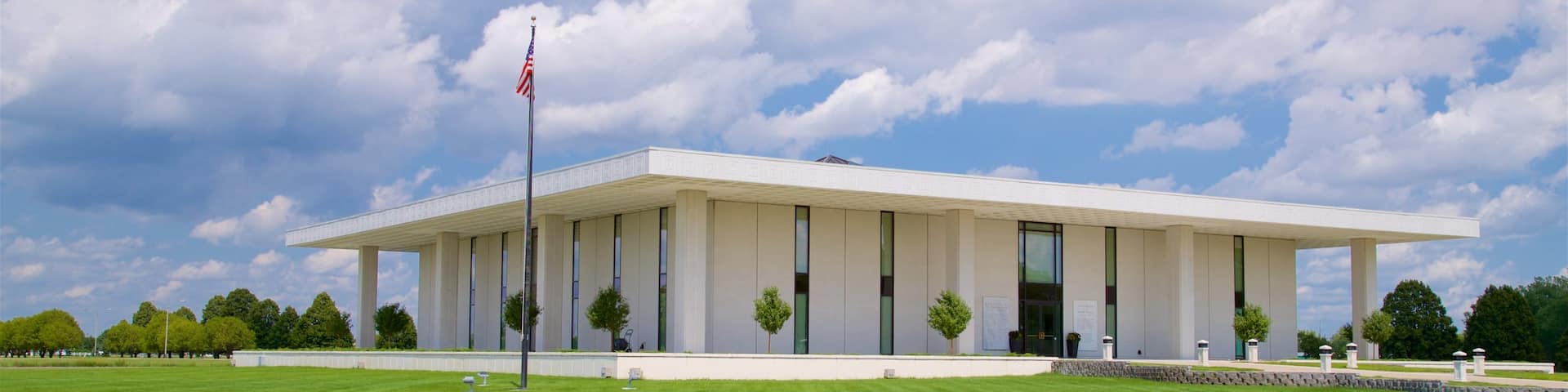Stuhr Museum of the Prairie Pioneer showing a lake or waterhole and modern architecture
