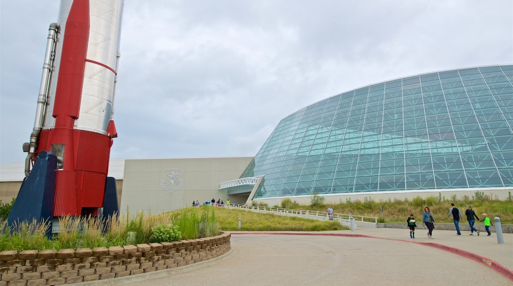 Strategic Air Command and Aerospace Museum featuring modern architecture as well as a family