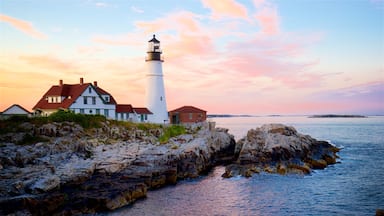 Portland Head Light showing rocky coastline, general coastal views and a sunset