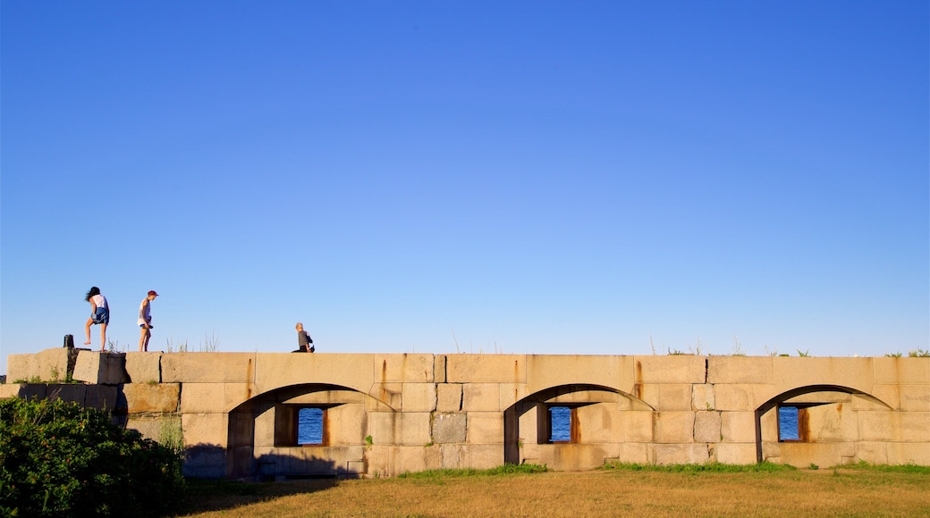 Fort Preble featuring heritage elements as well as a small group of people