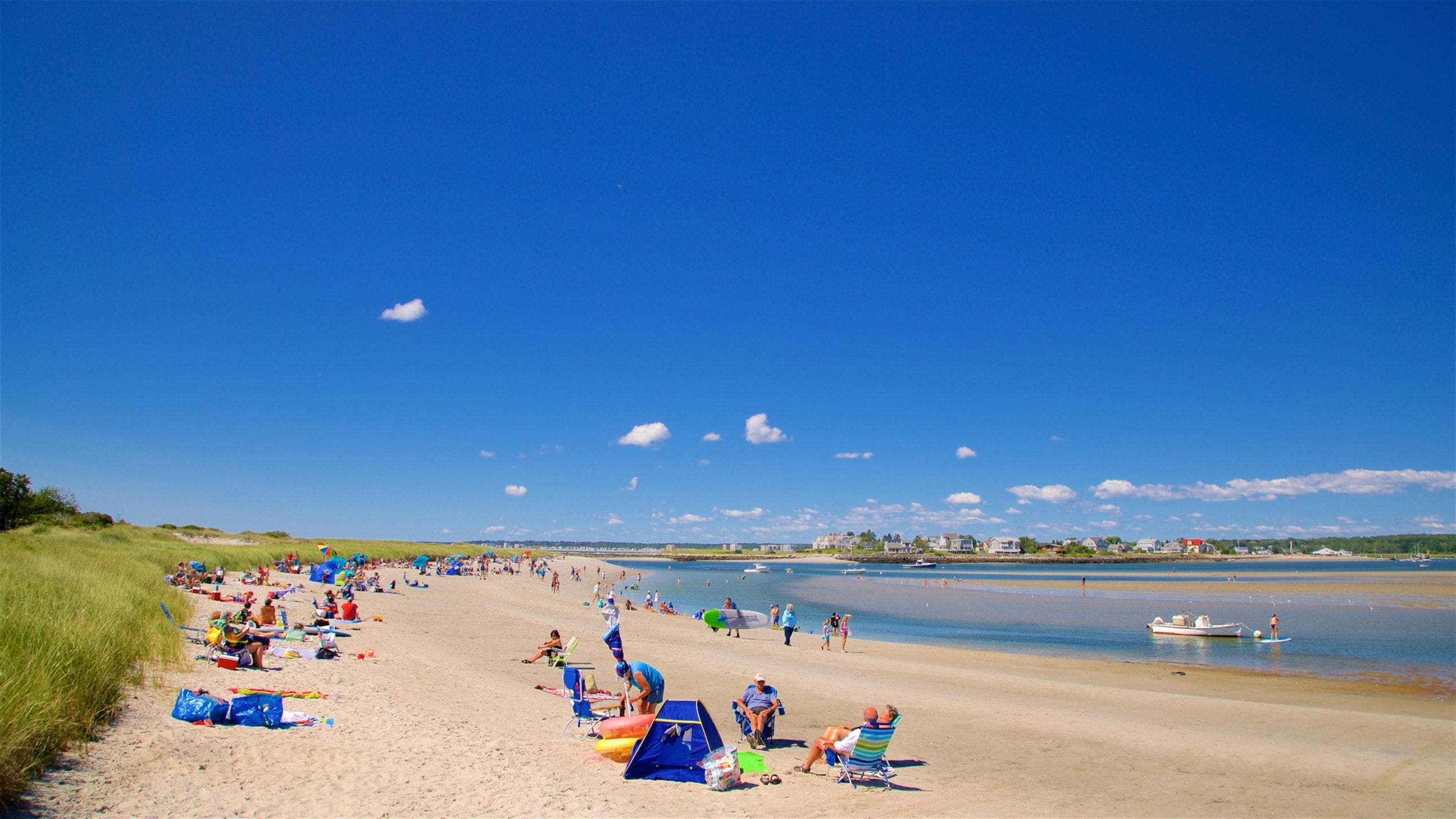 Scarborough showing a sandy beach and general coastal views as well as a small group of people