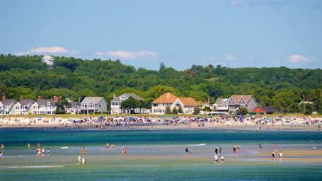 Scarborough featuring a coastal town and general coastal views as well as a large group of people