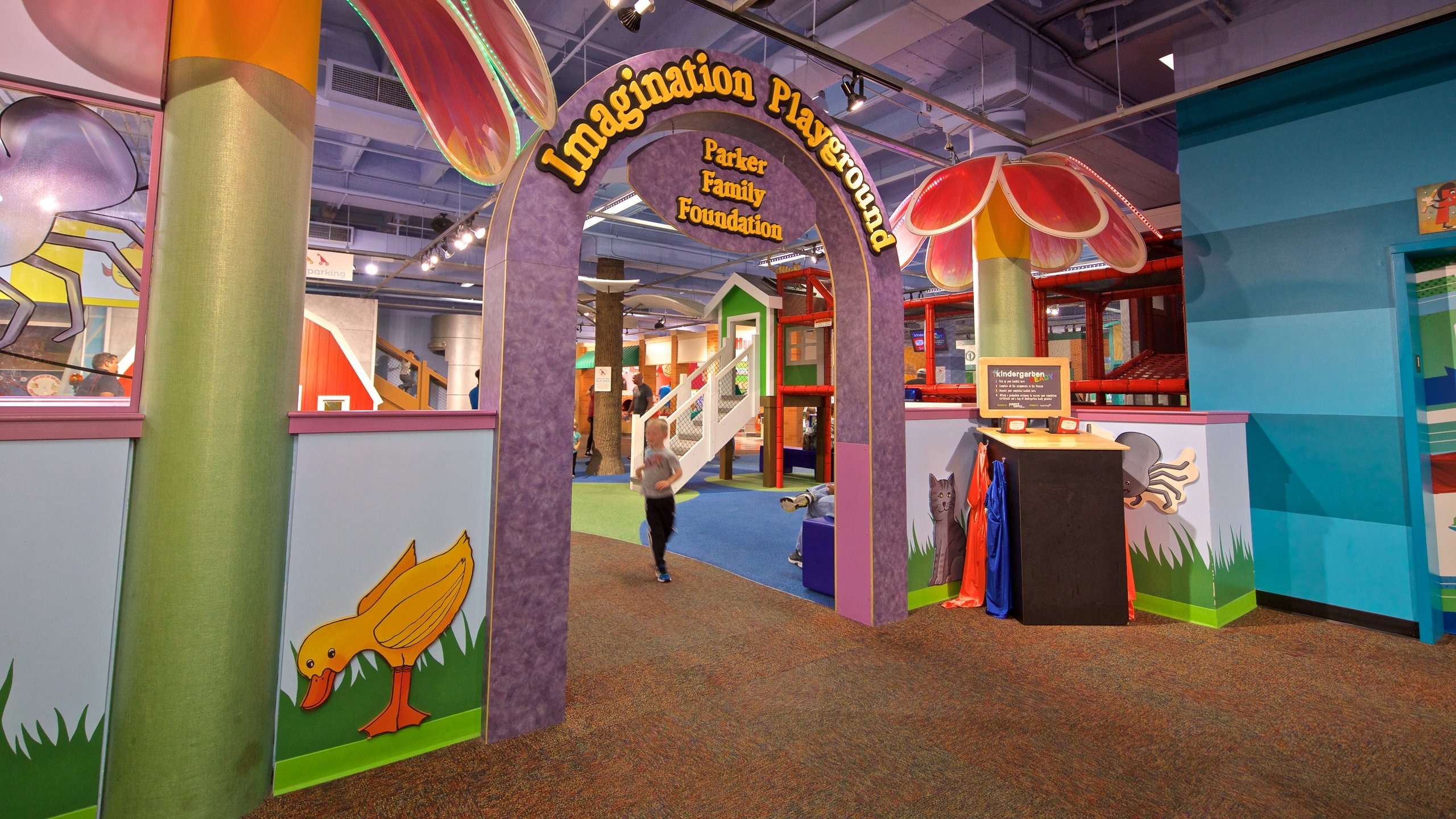 Omaha Children\'s Museum which includes signage and interior views as well as an individual child