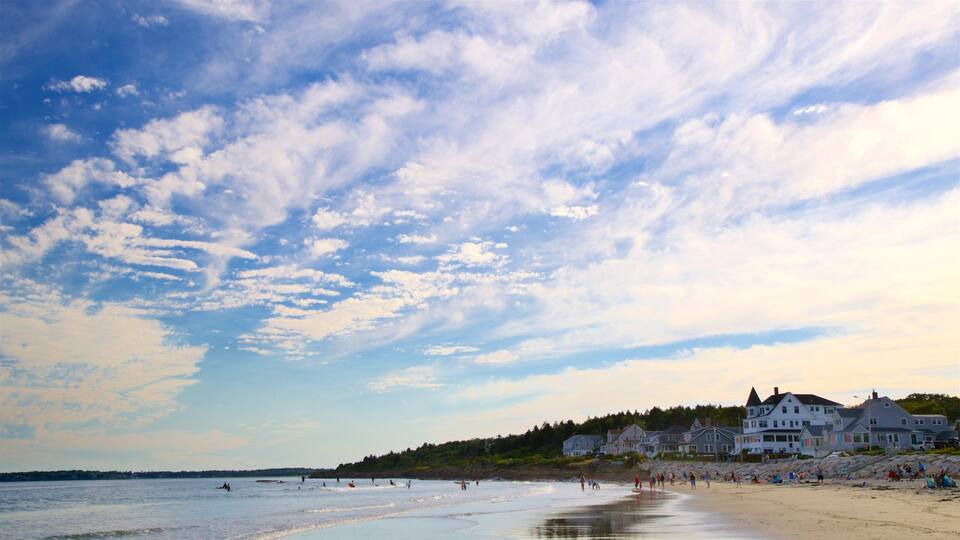 Higgins Beach featuring a coastal town, a sandy beach and a sunset