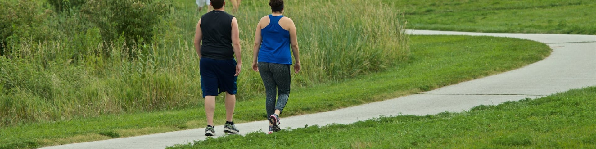 Zorinsky Lake Park showing hiking or walking and a garden as well as a couple