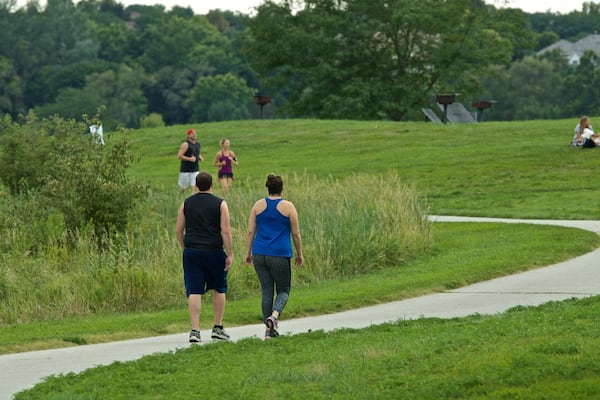 Zorinsky Lake Park featuring hiking or walking and a garden as well as a couple