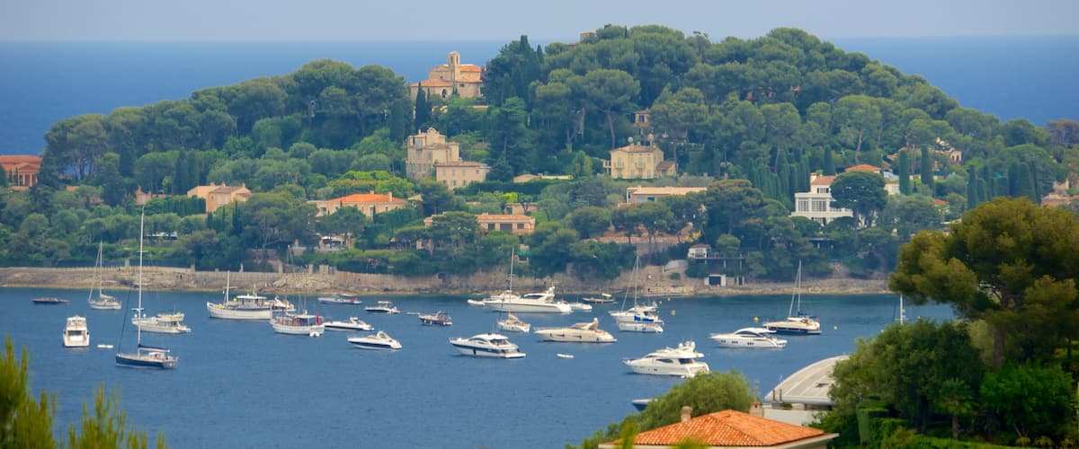 Monaco featuring a small town or village, general coastal views and island views