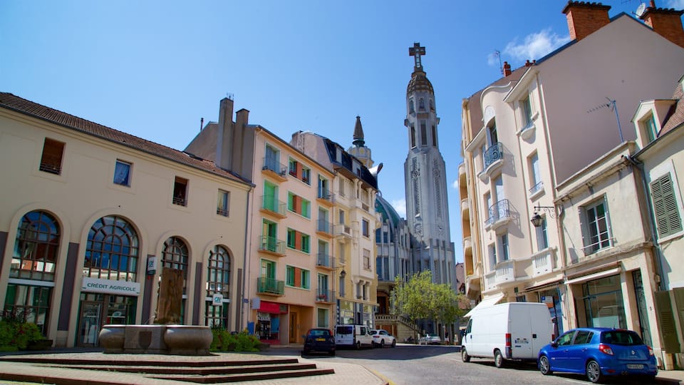 Église St-Blaise showing heritage architecture and a city
