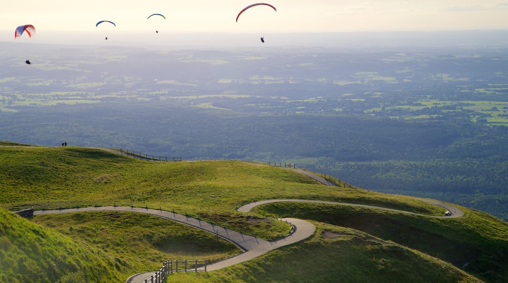 Puy de Dome featuring landscape views, skydiving and a sunset