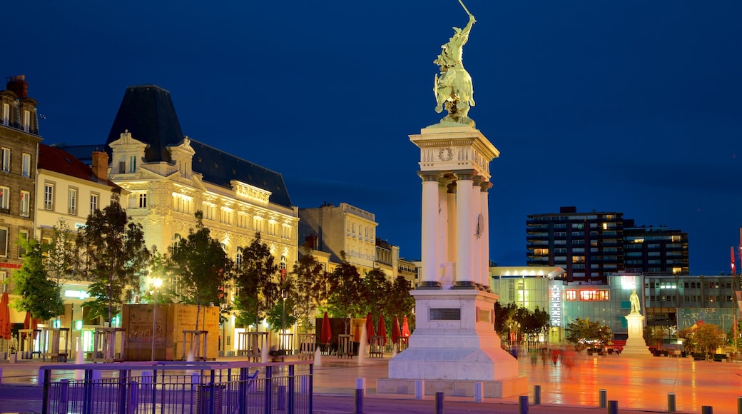 Place de Jaude which includes night scenes, a statue or sculpture and a square or plaza