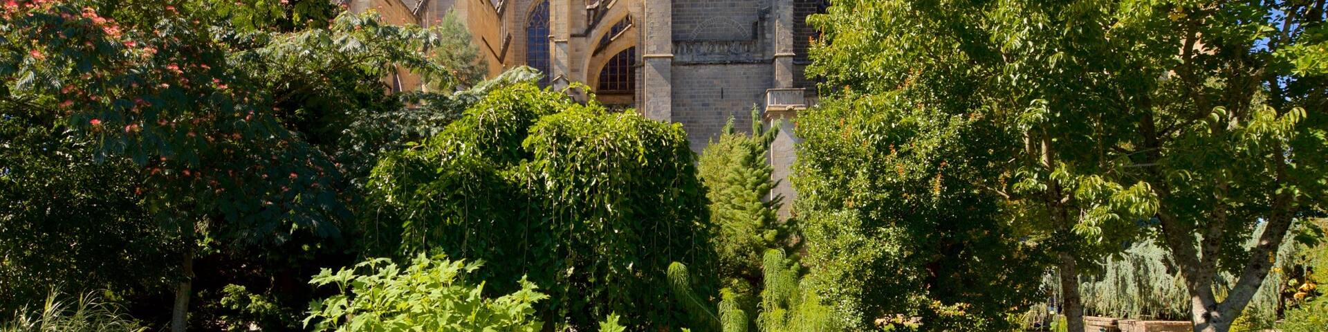 Jardin de l\'Eveche featuring a church or cathedral and heritage architecture