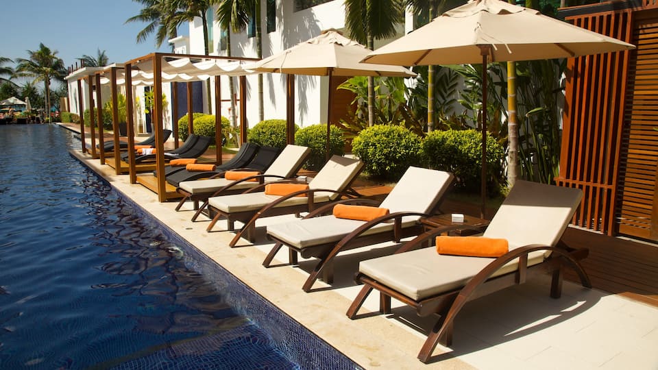 Phuket featuring tropical scenes, a hotel and a pool