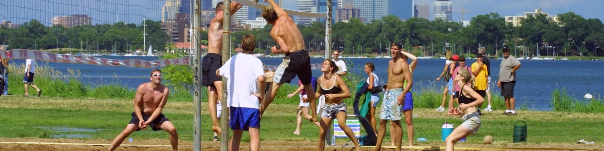 Bde Maka Ska showing a sporting event, a skyscraper and a city